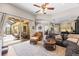 Spacious living room with sliding glass doors to the lanai and open concept to dining and kitchen areas at 743 Stonecrest Dr, Sarasota, FL 34232