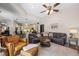 Spacious living room featuring wood floors and open-concept design to the kitchen with bar-style seating at 743 Stonecrest Dr, Sarasota, FL 34232