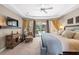 Comfortable main bedroom with ceiling fan, and view of outdoor swimming pool at 743 Stonecrest Dr, Sarasota, FL 34232