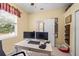 Bright office with window, artwork, and desk with dual monitors at 743 Stonecrest Dr, Sarasota, FL 34232