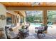 Covered patio and pool area with seating and view of backyard at 743 Stonecrest Dr, Sarasota, FL 34232