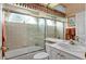 Bathroom featuring glass shower doors and white vanity at 7513 Coventry Ct, Lakewood Ranch, FL 34202