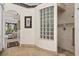 Bathroom featuring tiled walk-in shower and glass block window at 7513 Coventry Ct, Lakewood Ranch, FL 34202