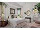Bright bedroom with neutral tones, a corner view, and an ensuite bathroom at 7513 Coventry Ct, Lakewood Ranch, FL 34202
