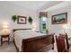 Bright bedroom features wood furniture and calm natural light at 7513 Coventry Ct, Lakewood Ranch, FL 34202