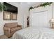 Cozy bedroom featuring a large closet, sofa, and decor at 7513 Coventry Ct, Lakewood Ranch, FL 34202