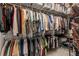 Walk-in closet with ample hanging storage, shelves and storage containers at 7513 Coventry Ct, Lakewood Ranch, FL 34202