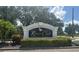 River Club deed-restricted community sign with manicured landscaping, offering an exclusive neighborhood at 7513 Coventry Ct, Lakewood Ranch, FL 34202