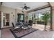The covered patio features a dining table with views of the backyard at 7513 Coventry Ct, Lakewood Ranch, FL 34202