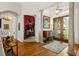 Welcoming foyer with marble columns, hardwood floors, and decorative glass doors leading to the entrance at 7513 Coventry Ct, Lakewood Ranch, FL 34202