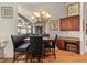 Breakfast nook with hardwood floors, black leather benches, and window view at 7513 Coventry Ct, Lakewood Ranch, FL 34202