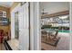 View from home into lanai with a dining area, ceiling fan, and swimming pool at 7513 Coventry Ct, Lakewood Ranch, FL 34202