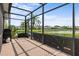 Outdoor patio overlooking scenic pond, featuring a grill, ideal for entertaining at 7513 Coventry Ct, Lakewood Ranch, FL 34202