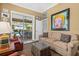 Living room with view to backyard patio and pool at 7513 Coventry Ct, Lakewood Ranch, FL 34202