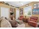 Comfortable living room with cozy seating, neutral sofa, and natural light at 7513 Coventry Ct, Lakewood Ranch, FL 34202