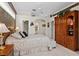 Comfortable main bedroom with a built in armoire and walk-in closet at 7513 Coventry Ct, Lakewood Ranch, FL 34202