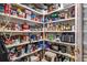 Organized pantry with plentiful shelving for food storage and kitchen appliances at 7513 Coventry Ct, Lakewood Ranch, FL 34202