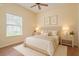 Comfortable bedroom with a plush bed, soft lighting, and tasteful decor for a relaxing ambiance at 8382 Creekview Ln, Englewood, FL 34224