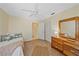 Spacious bedroom boasting wood floors, closet space, and access to an en-suite bathroom at 8382 Creekview Ln, Englewood, FL 34224