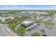 Aerial shot showing a Starbucks with a drive-thru, alongside a busy commercial area and retail stores at 8382 Creekview Ln, Englewood, FL 34224
