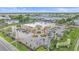 Aerial view of a Walgreens commercial building with palm trees, landscaping, and convenient parking at 8382 Creekview Ln, Englewood, FL 34224