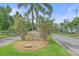 Oyster Creek community entrance sign framed by trees and landscaping at 8382 Creekview Ln, Englewood, FL 34224