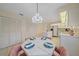 Bright dining space with ample storage, creating a welcoming and functional space for meals and gatherings at 8382 Creekview Ln, Englewood, FL 34224