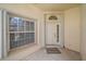 Inviting front entrance featuring a secure front door and welcome mat at 8382 Creekview Ln, Englewood, FL 34224