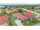 Inviting single-story home featuring a tile roof, well-maintained landscaping, and a spacious driveway at 8382 Creekview Ln, Englewood, FL 34224
