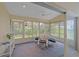 Relaxing sunroom with lots of windows and ceiling fan, perfect for enjoying natural light and outdoor views at 8382 Creekview Ln, Englewood, FL 34224