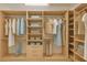 Spacious walk-in closet with custom shelving and plenty of storage at 8382 Creekview Ln, Englewood, FL 34224