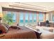 Beautiful main bedroom with ocean views and access to the balcony at 845 Longboat Club Rd, Longboat Key, FL 34228