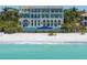 Stunning beachfront home with multiple levels, a pool, and direct access to the sandy beach at 845 Longboat Club Rd, Longboat Key, FL 34228