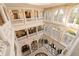 Stunning foyer with detailed architecture, marble floors and an abundance of natural light at 845 Longboat Club Rd, Longboat Key, FL 34228