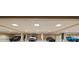 Clean and brightly illuminated parking space for multiple vehicles with smooth flooring and recessed lighting at 845 Longboat Club Rd, Longboat Key, FL 34228