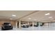 Expansive garage featuring parking for multiple vehicles, bright lighting and neutral colors with a clean design at 845 Longboat Club Rd, Longboat Key, FL 34228