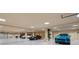 Brightly lit, expansive garage with space for multiple cars and well-maintained flooring, a modern and organized space at 845 Longboat Club Rd, Longboat Key, FL 34228