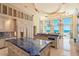 A kitchen with large windows and island with a view of the ocean at 845 Longboat Club Rd, Longboat Key, FL 34228