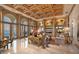An elegant living room with beautiful artwork and stunning ocean views at 845 Longboat Club Rd, Longboat Key, FL 34228