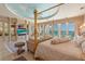 Luxurious bedroom with a custom ceiling, built-in cabinets and a private balcony with ocean view, adding sophistication at 845 Longboat Club Rd, Longboat Key, FL 34228