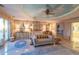 Luxurious bedroom with canopy bed, elegant furnishings, and a custom painted ceiling creating a serene retreat at 845 Longboat Club Rd, Longboat Key, FL 34228