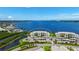 Panoramic aerial view of waterfront condo building with covered parking and stunning water views at 850 Tidewater Shores Loop # 108, Bradenton, FL 34208