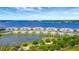 Aerial view of waterfront condos with a lake in front at 850 Tidewater Shores Loop # 108, Bradenton, FL 34208
