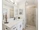 Elegant bathroom with quartz counters, under mount sink, and a glass-enclosed tiled shower at 850 Tidewater Shores Loop # 108, Bradenton, FL 34208