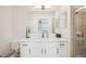 Featuring quartz countertop, modern fixtures, and a glass shower, this bathroom exudes elegance and style at 850 Tidewater Shores Loop # 108, Bradenton, FL 34208