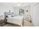 A cozy bedroom featuring a comfortable bed, bright window and contemporary decor, creating a peaceful retreat at 850 Tidewater Shores Loop # 108, Bradenton, FL 34208