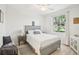 A cozy bedroom featuring a comfortable bed, bright window and contemporary decor, creating a peaceful retreat at 850 Tidewater Shores Loop # 108, Bradenton, FL 34208