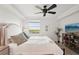 Cozy bedroom featuring a comfortable king bed, ceiling fan, modern decor, and a picturesque window view at 850 Tidewater Shores Loop # 108, Bradenton, FL 34208