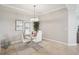 Charming dining area with a glass table, seating four, and bathed in natural light at 850 Tidewater Shores Loop # 108, Bradenton, FL 34208