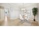 Elegant dining room featuring a modern chandelier, stylish decor, and plenty of natural light at 850 Tidewater Shores Loop # 108, Bradenton, FL 34208